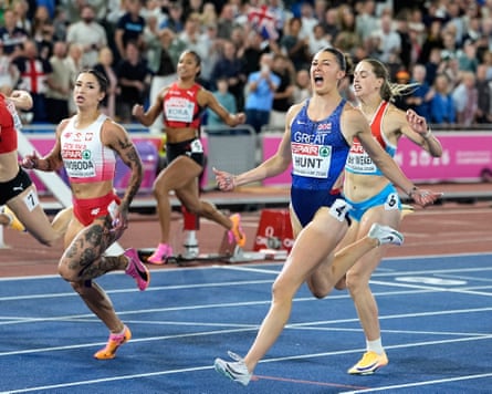 Britain’s Amy Hunt reacts after crossing the finish line ahead of Poland’s Ewa Swoboda to win the women’s 100 meters final at the European Athletics Championships in Birmingham