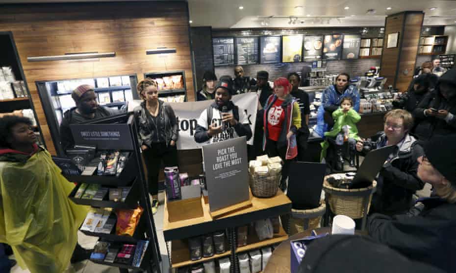 Protesters inside the Starbucks in Philadelphia on Monday where two black men were arrested while they were waiting for a friend in the store.