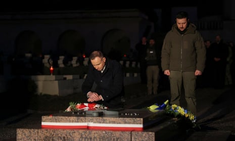 Poland’s president Andrzej Duda and Ukraine’s counterpart Zelenskiy commemorate fallen Ukrainian defenders at a cemetery in Lviv.