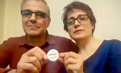 Nasrin Sotoudeh and her husband Reza Khandan hold up a protest badge that reads: ‘I oppose the mandatory hijab.’