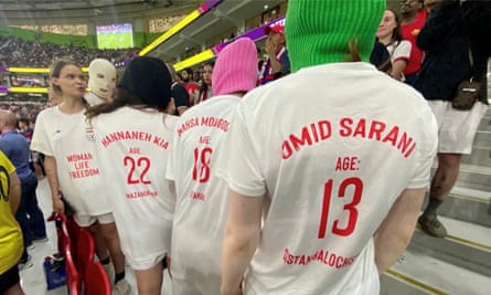 Members of Pussy Riot wear T-Shirts bearing the name of women killed in Iran, with their ages, during the match between Iran and United States of the FIFA World Cup Qatar 2022 in Doha.