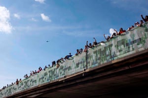 Protesters gather on a highway overpass to protest and mourn George Floyd, a black man who died after a white policeman kneeled on his neck for several minutes during the “Justice 4 George Floyd” event in Houston, Texas on May 29, 2020. - Demonstrations are being held across the US after George Floyd died in police custody on May 25.