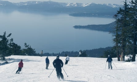 Skiers and snowboarders enjoy spectacular views of Lake Tahoe.