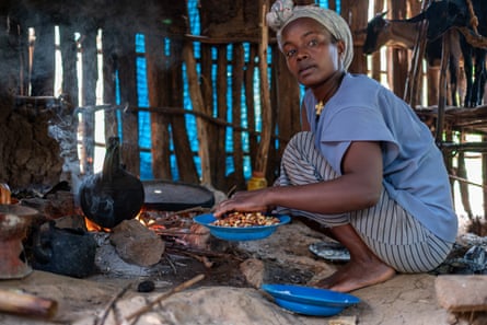 Hagre Bekele prepares coffee at her home in Kafa