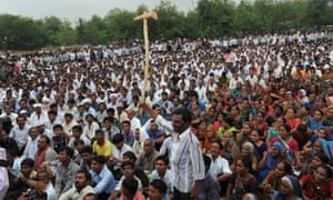 Indian farmers protest during a rally in Gandhinagar, capital of India's Gujarat state, some 30 kms. from Ahmedabad, on June 18, 2013. Nearly 5,000 farmers took out a tractor rally today from Vitthlapur crossroads near Viramgam to Gandhinagar protesting against the Gujarat government's decision to develop Mandal-Becharaji as Special Investment Region (SIR), which also houses Maruti Suzuki India's (MSI) proposed plant. AFP PHOTO / Sam PANTHAKY (Photo credit should read SAM PANTHAKY/AFP/Getty Images)