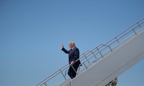 Donald Trump arrives at Arizona’s Phoenix Sky Harbor airport on 5 May during his first trip since widespread Covid-19-related lockdowns went into effect.