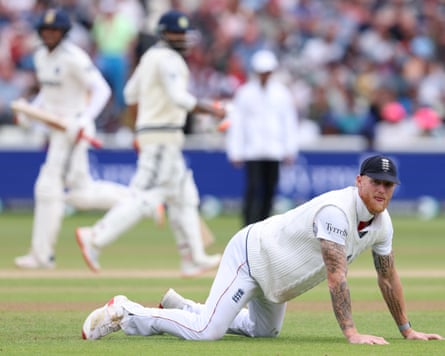 Ben Stokes, the England captain, looks on as Shubman Gill and Ravindra Jadeja of India take more runs.