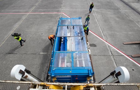 Tanks carrying the whales are inspected as they are unloaded at Keflavík airport.