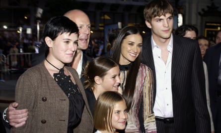 With ex-husband Bruce Willis, their daughters and her then partner Ashton Kutcher in 2001.