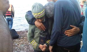 Mohammed Kher Edress, a Syrian professor from Homs, arrives on Greek soil in a state of shock, holding his two sons Ahmed and Amro.