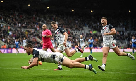 England's Elliott Whitehead dives to score a try.