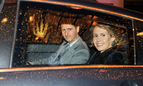 Bashar al-Assad and his wife Asma in a car on an official visit to Paris on 9 December 2010