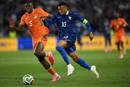 France’s Kylian Mbappé takes connected Côte d’Ivoire’s Wilfried Singo during their friends gathering successful Nantes this month.