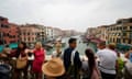 Tourists on Rialto bridge, in Venice, Italy.