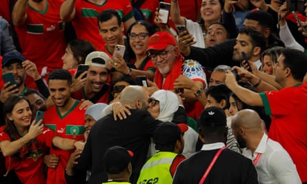 Walid Regragui hugs his mother after Portugal win.