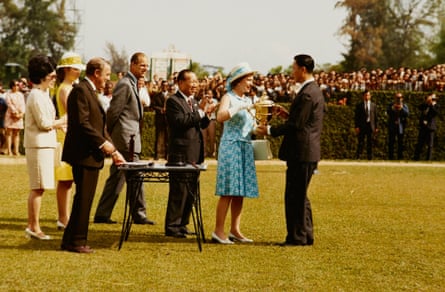 Queen Elizabeth II presents the Queen Elizabeth II Cup to its first winner at the Singapore Turf Club in 1972.
