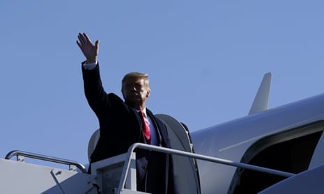 Donald Trump waves before departing Trenton-Mercer airport in Ewing Township, New Jersey, on Saturday.
