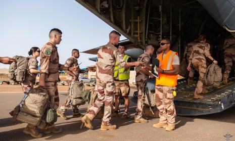 Soldiers board a transport airplane in Gao as the French military leave the last bases in Mali in June.