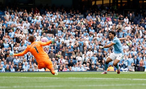 Manchester City's Omar Marmoush has his shot saved by Tottenham Hotspur's keeper Guglielmo Vicario.