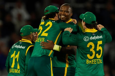 South Africa's Lungi Ngidi is congratulated by his teammates after bowling out England's Jos Buttler.