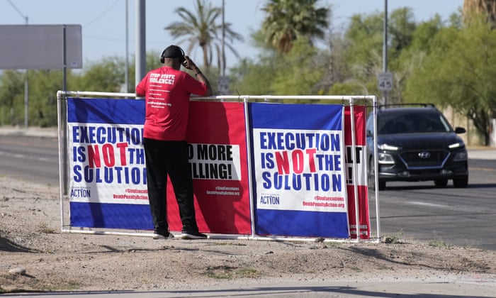 Protestor Charles Keith stands outside the state prison in Florence, Arizona on Wednesday.