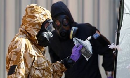 Forensic investigators wearing protective suits collect evidence after the poisoning of Dawn Sturgess and Charlie Rowley.