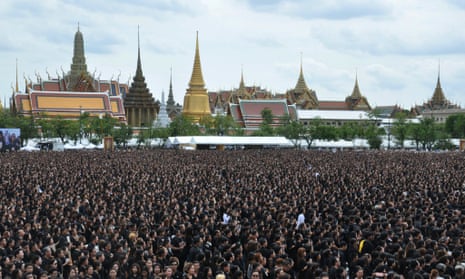 Mourners sing a special version of Thailand’s royal anthem in honour of King Bhumibol Adulyadej in Bangkok.