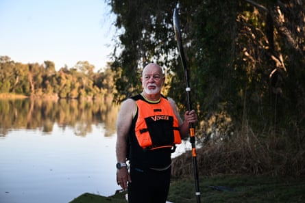 John Mackenzie stands in front of a river