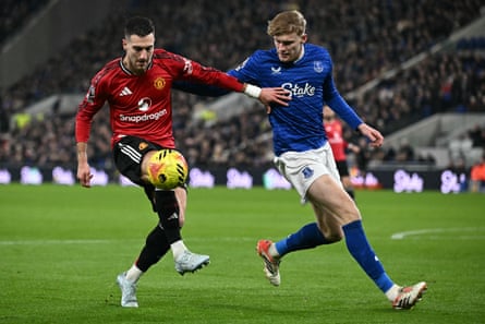 Manchester United's Diogo Dalot holds off Jarrad Branthwaite