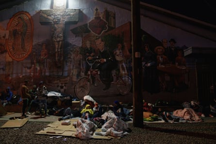 Migrants sleep outside the Sacred Heart church near the US-Mexico border in El Paso, Texas.