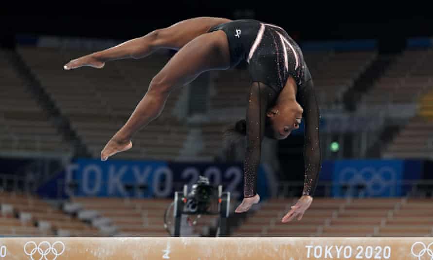 Simone Biles trains on the balance beam at the Ariake Gymnastics Center in Tokyo.