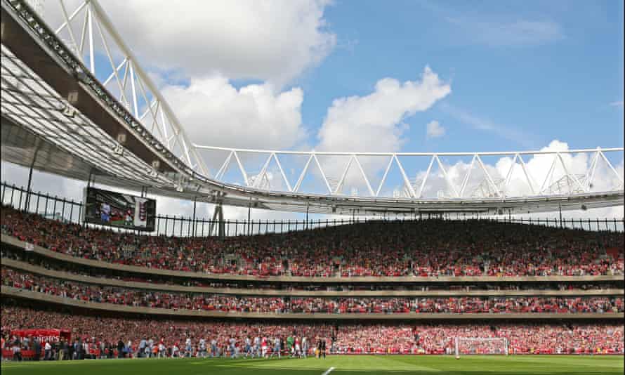 The Arsenal and Aston Villa players take to the pitch in August 2006 for the first competitive match at the Emirates Stadium