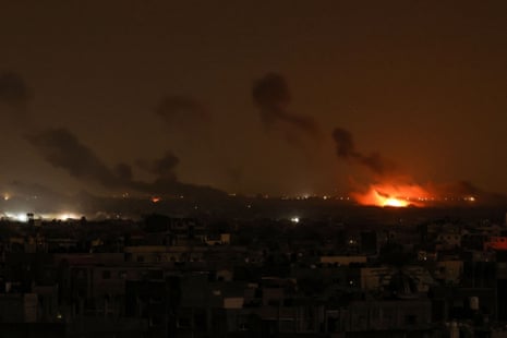 This picture taken from Rafah overnight shows smoke and fire rising above buildings during Israeli strikes on Khan Younis, one of the areas where Israel has been ordering Palestinians to flee to for safety.