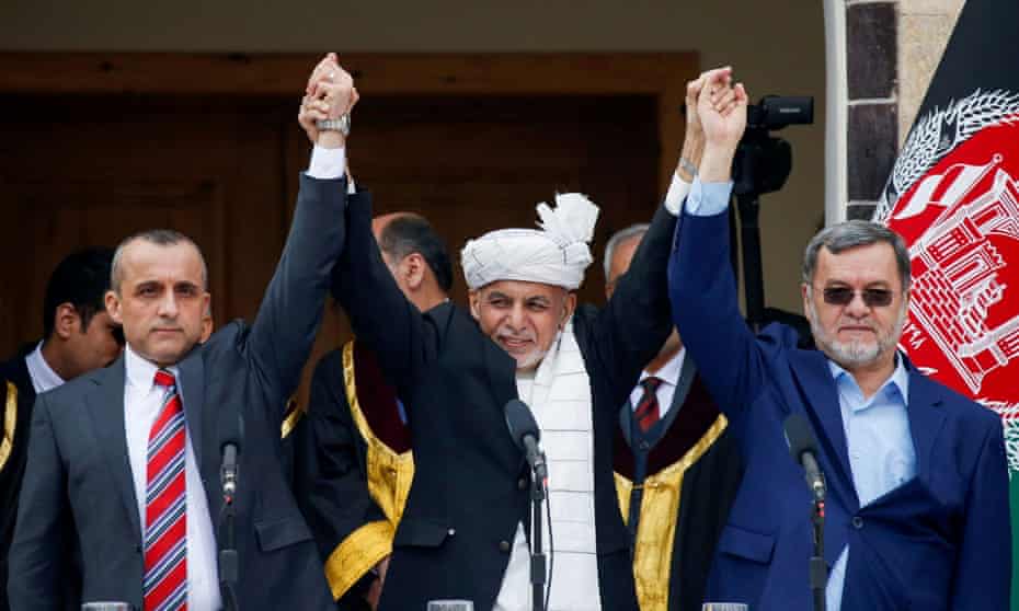 Afghanistan's ex-president Ashraf Ghani (c), ex-first vice president Amrullah Saleh (l) and ex-second vice president Sarwar Danish (r) at their swearing-in ceremony in Kabul on 9 March 2020. 