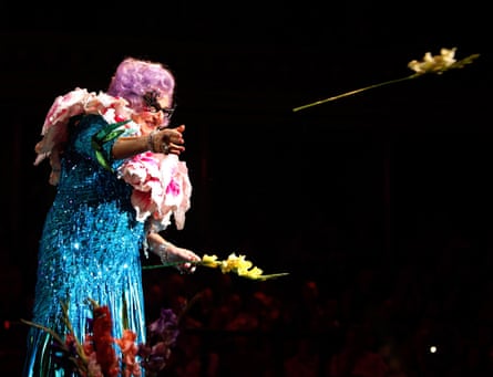 Dame Edna Everage throws her trademark gladioli into the audience at Last Night Of The Poms at Royal Albert Hall in London in 2009.