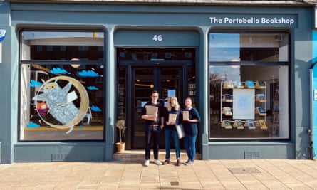 ‘We’ve had a big increase in people ordering via our website and over the phone, which has been great.’ Staff at The Portobello Bookshop in Edinburgh holding books to be hand-delivered.