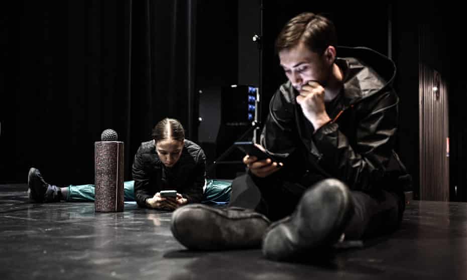 members of the grand ballet de kiev in france last week use their mobile phones to check the news from ukraine