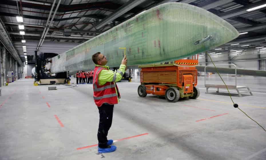 A technician at Siemens’ wind turbine plant in Hull; the 75m blade is the largest object cast as a single piece anywhere in the world.
