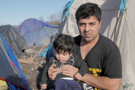 British citizen Rawand Aziz with his son Oscar at the Dunkirk camp.