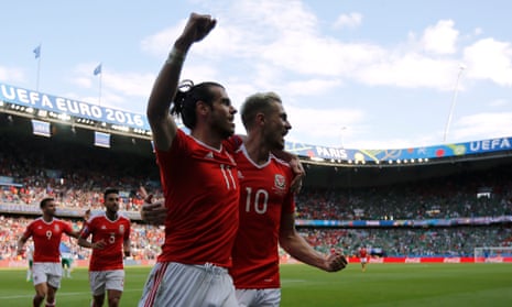 Wales’ Gareth Bale and Aaron Ramsey celebrate after Northern Ireland’s Gareth McAuley scores a own goal.