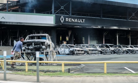 Burnt cars and a burnt Renault car shop in Nouméa, on Tuesday