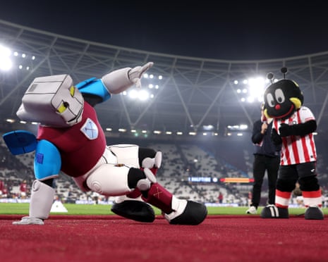 West Ham mascot Hammerhead throws some moves during a dance off with Brentford mascot Buzz Bee.