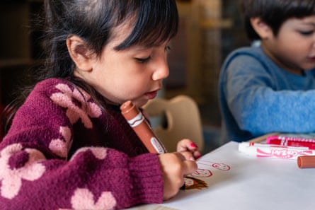 a young girl drawing