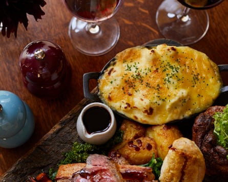 Meat and red wine served at a pub