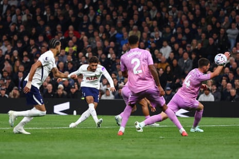 Omar Marmoush strikes the ball past pink-clad defenders as the goalkeeper dives to save it