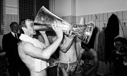 Captain Mick Mills sups from the cup as the Ipswich Town players celebrate after the second leg of the UEFA Cup final.
