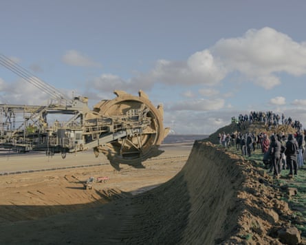 Activists block the bucket wheel excavator at the edge of the Garzweiler II open-pit mine on the outskirts of the village