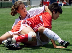 Mia Hamm (left) wrestles with China defender Bai Jie at the 1999 World Cup final.
