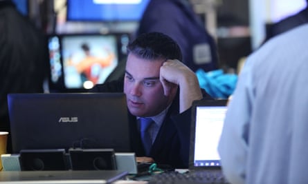 A trader stares at a computer at the New York stock exchange