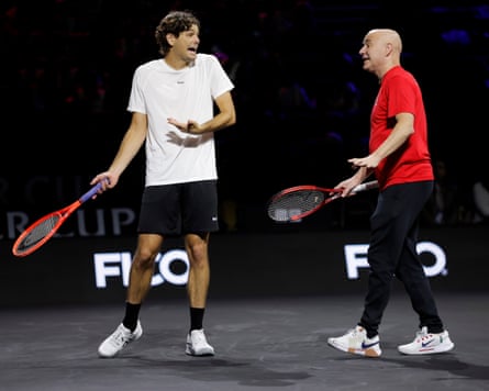 Taylor Fritz, a player for Team World at the 2026 Laver Cup tennis event, talks with the team’s captain, Andre Agassi, during practice for the event.